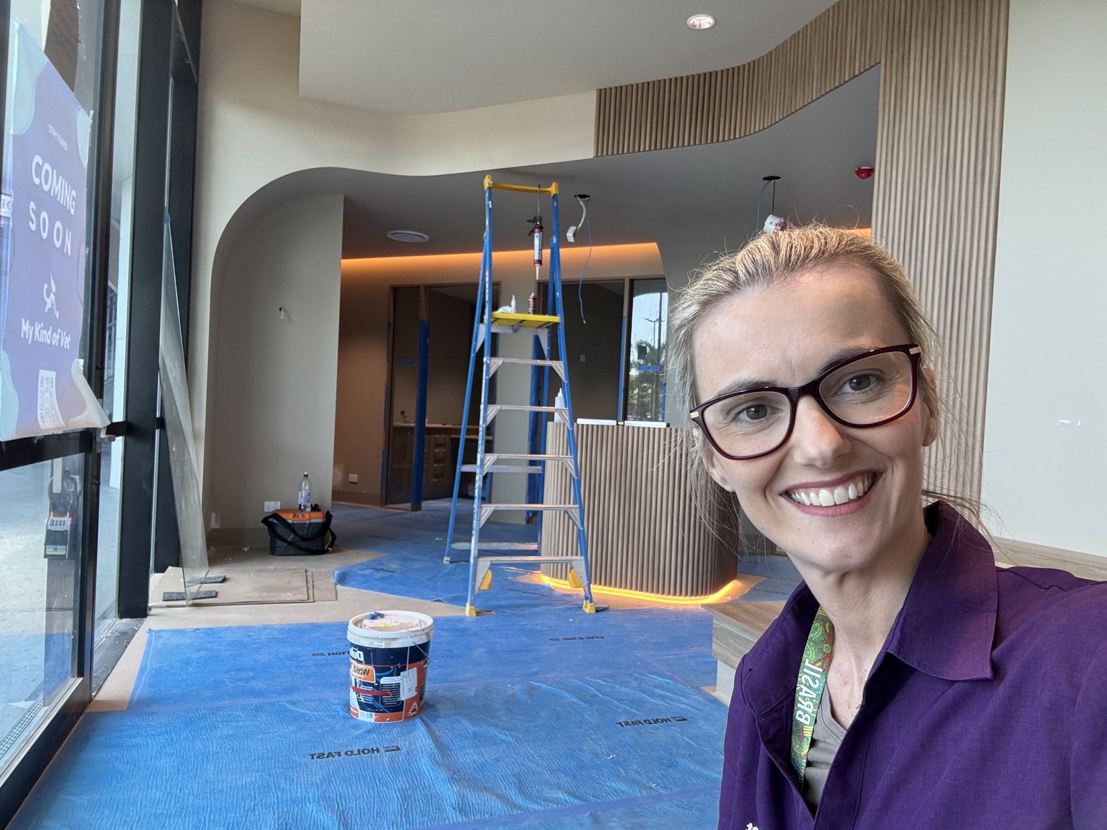 Dr Anna in the almost-finished clinic with the Coming Soon sign in the window at My Kind of Vet, Ormeau